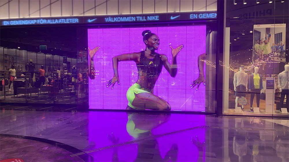 Transparent LED video wall in shopping mall corridor