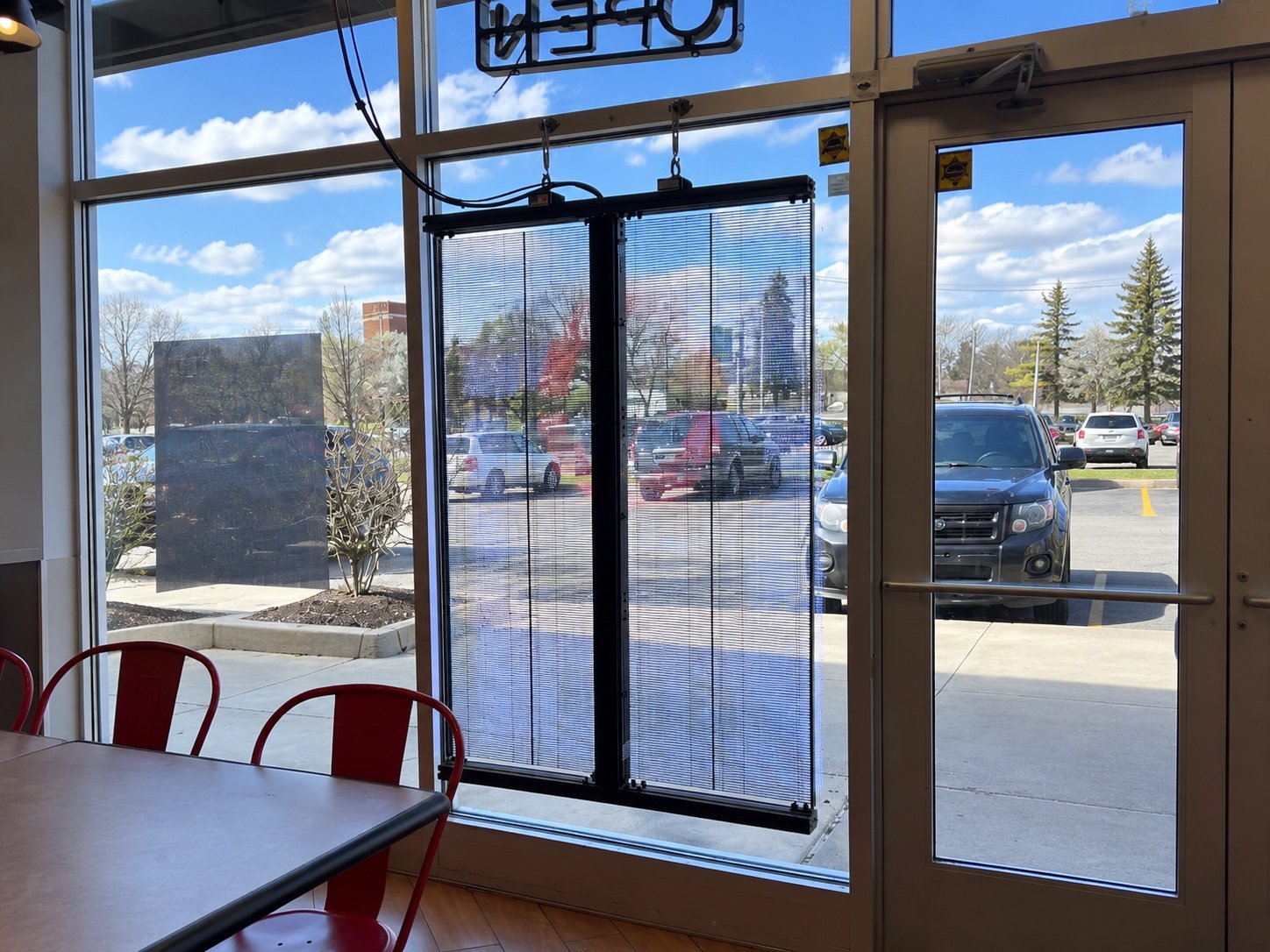 Interior view through the transparent LED poster at Lefty's Detroit
