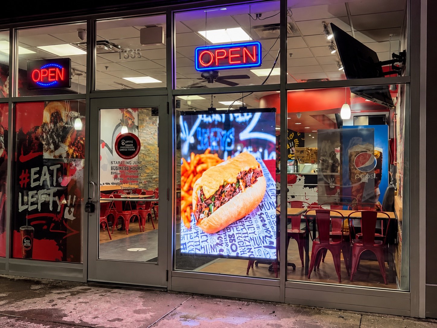 Lefty's Detroit transparent LED poster illuminated at night