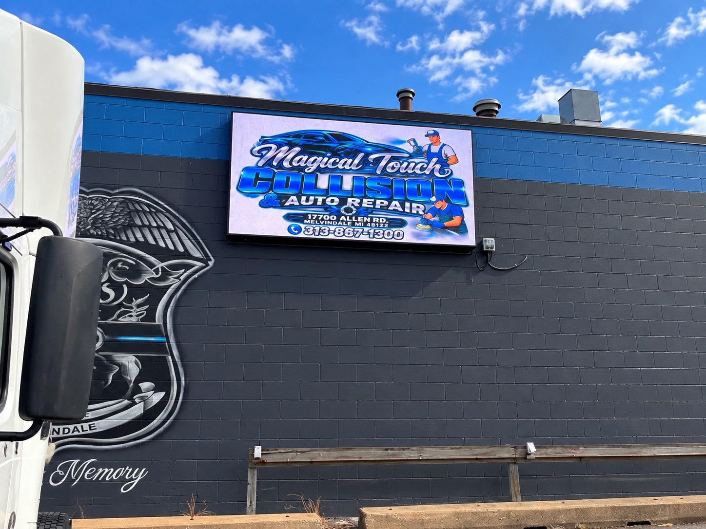 PixaClear LED wall-mounted outdoor display showing live content on a commercial building in Melvindale, Michigan