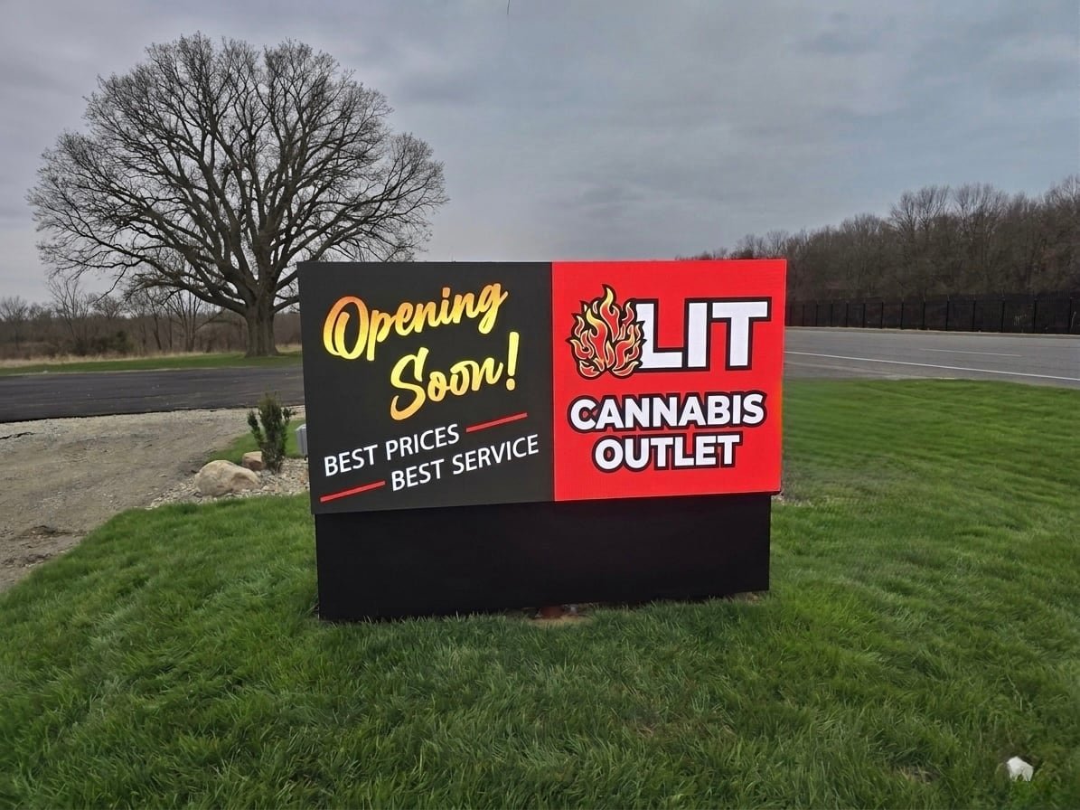 Completed hybrid LED monument sign with fixed branding and a digital message display in New Buffalo, Michigan
