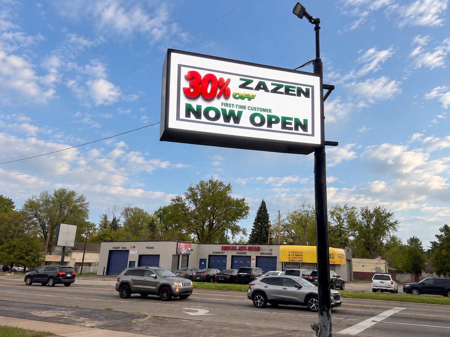 Completed Zazen outdoor LED pole sign advertising a first-time customer promotion