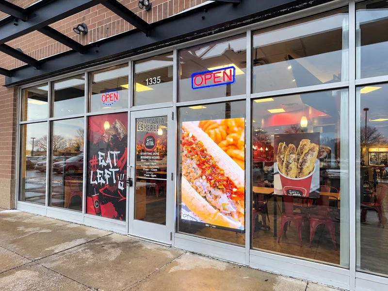 PixaClear LED transparent screen behind storefront glass at Lefty's in Detroit, Michigan