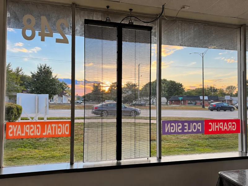 View through a transparent LED window display from inside SignLab in Troy, Michigan